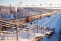 Svir, Russia,01.02.24: Svir railway station on the Oktyabrskaya railway. Passenger freight trains on rails. People and