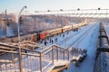 Svir, Russia,01.02.24: Svir railway station on the Oktyabrskaya railway. Passenger freight trains on rails. People and