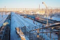 Svir, Russia,01.02.24: Svir railway station on the Oktyabrskaya railway. Passenger freight trains on rails. People and