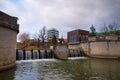 Svitava river with weir in Blansko near the railway station. Royalty Free Stock Photo