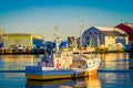 SVOLVAER, LOFOTEN ISLANDS, NORWAY - APRIL 10, 2018: View of Fishing boat in harbour, Svolvaer, Lofoten Islands County is Royalty Free Stock Photo