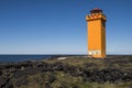 Svortuloft Lighthouse with black rocks