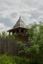 Wooden tower and fence on the territory of the All Saints Skete