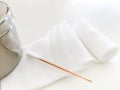 Swab and roll gauze bandage and jar in medical concept