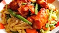 Swabian spaetzle with green beans and carrots and grilled chicken