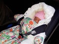 Swaddled newborn girl sleeping in the car Royalty Free Stock Photo