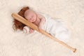 Swaddled Sleeping Baby Boy With a Baseball Bat Royalty Free Stock Photo