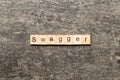 swagger word written on wood block. swagger text on table, concept