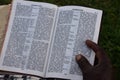 Swahili Bible with hand and finger on the bible from an african men