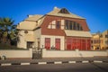 Old-time German buildings and architecture: houses, shops and road in an African city