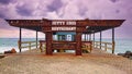 Swakopmund, Namibia - Nov 25, 2015: Rusty steel entrance to Jetty 1905 Restaurant and pier at coast of Swakopmund. Dark