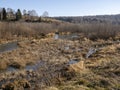 The swampy part of the Suenga river in Siberia in autumn, among the hills