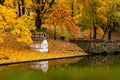 Swan House in Bastion Hill Park  Riga reflecting in canal water during beautiful autumn day surrounded with yellow leaved trees Royalty Free Stock Photo