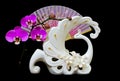 Decorative Swan Shape Flower Vase With Pink Orchids And Oriental Folding Fan  On Dark Background