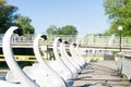 Swan shaped boats charging at landing stage near lake Royalty Free Stock Photo