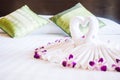 Swan towel on bed