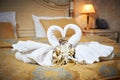 Swans out of towels on the bed