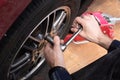 Swapping winter wheels and tires to summer on your car. Break bar and Car jack being used