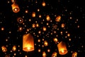 Swarms of sky floating lanterns are launched into the air during New year`s eve and Yee Peng lantern festival traditional at Royalty Free Stock Photo