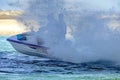 Young jet-setters playing joyfully in the waves with a jet-ski on the Swarkops River at Port Elizabeth, South Africa.