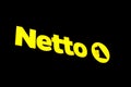 Swarzedz, Poland - November 2022: Logo of Netto supermarket network by night.