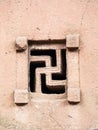 A swastika shaped window of Bete Maryam church in Lalibela, Ethiopia. Royalty Free Stock Photo