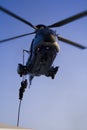 SWAT Agent Descending from a Helicopter