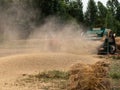 Swat, Pakistan - 24 May 2023: Wheat thresher operating in the field