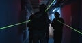 SWAT team with commander walking in dark corridor
