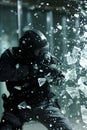 Swat team member smashing shatter glass falling