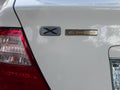 SWAT VALLEY, PAKISTAN - OCTOBER 05, 2021: Toyota x corolla 40th anniversary logo on a white 2006 model trunk Royalty Free Stock Photo