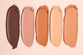 Swatches of liquid foundation makeup in different skin shades