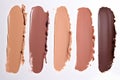 Swatches showing different skin shades of foundation makeup on white background