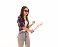 Young cute woman with fly swatter, isolated Royalty Free Stock Photo