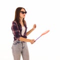 Young cute woman with fly swatter, isolated Royalty Free Stock Photo