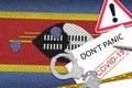 Swaziland flag and police handcuffs with inscription Don`t panic on white paper. Coronavirus or 2019-nCov virus concept