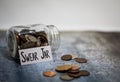 Swear Jar challenge concept with glass jar filled with coins, simple background Royalty Free Stock Photo
