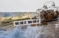 Swear Jar challenge concept with glass jar filled with coins, simple background Royalty Free Stock Photo