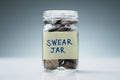 Swear Jar Filled With Coins Against Grey Background Royalty Free Stock Photo