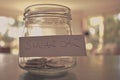 Swear jar filled with coins Royalty Free Stock Photo