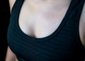 Sweat on woman chest after heavy cardio workout and weight training in gym. Woman chest after workout. Athlete exercise in fitness Royalty Free Stock Photo