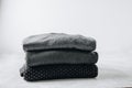 Sweaters. Black knitted sweaters on gray background