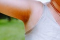 Sweaty armpit woman with wet spot on clothes