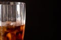 Sweaty cola soda glass with ice Royalty Free Stock Photo
