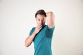 Sweaty man with stain on t-shirt against white background Royalty Free Stock Photo