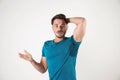 Sweaty man with stain on t-shirt against white background Royalty Free Stock Photo