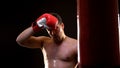 Sweaty sportsman feeling tired after exhausted boxing training, motivation