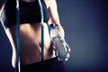 Sweaty woman after training holding water bottle Royalty Free Stock Photo