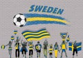 Swede football fans cheering with Sweden flag colors in front of