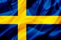 Sweden country flag on silk or silky waving texture Royalty Free Stock Photo